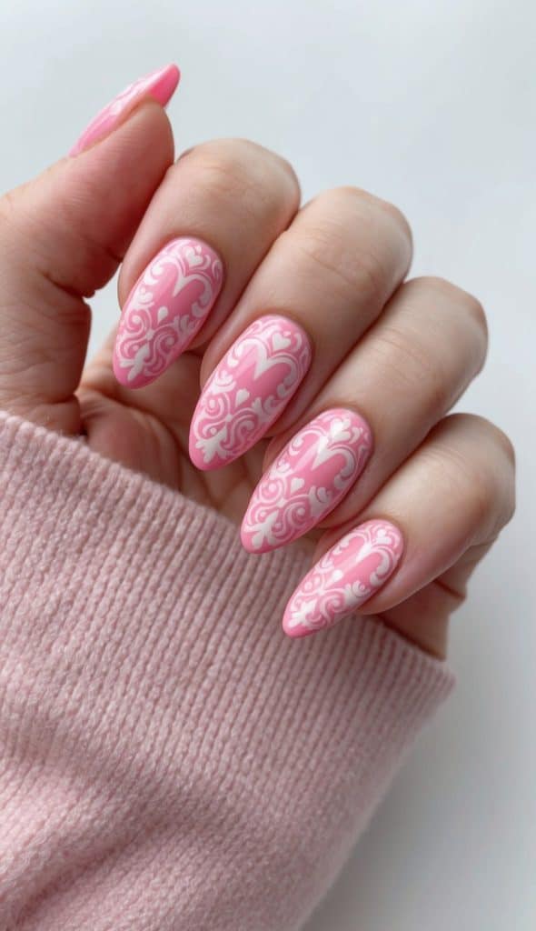 Long pink nails with detailed white lace patterns