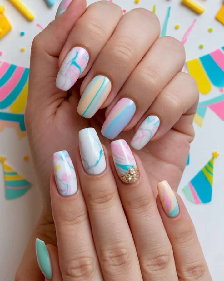 A colorful array of marble pastel nails for a festive birthday-themed nail design