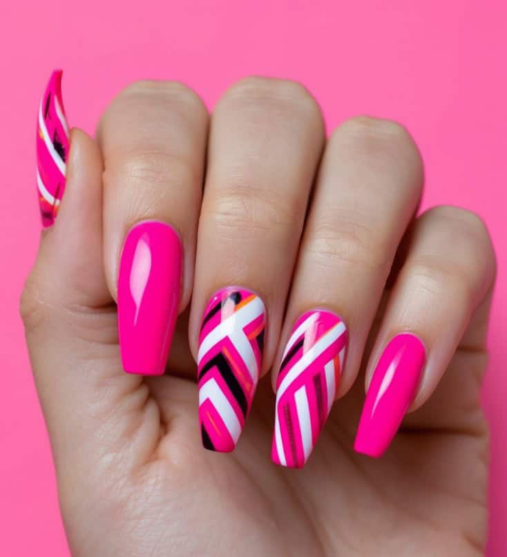 Hot pink nails with bold geometric patterns