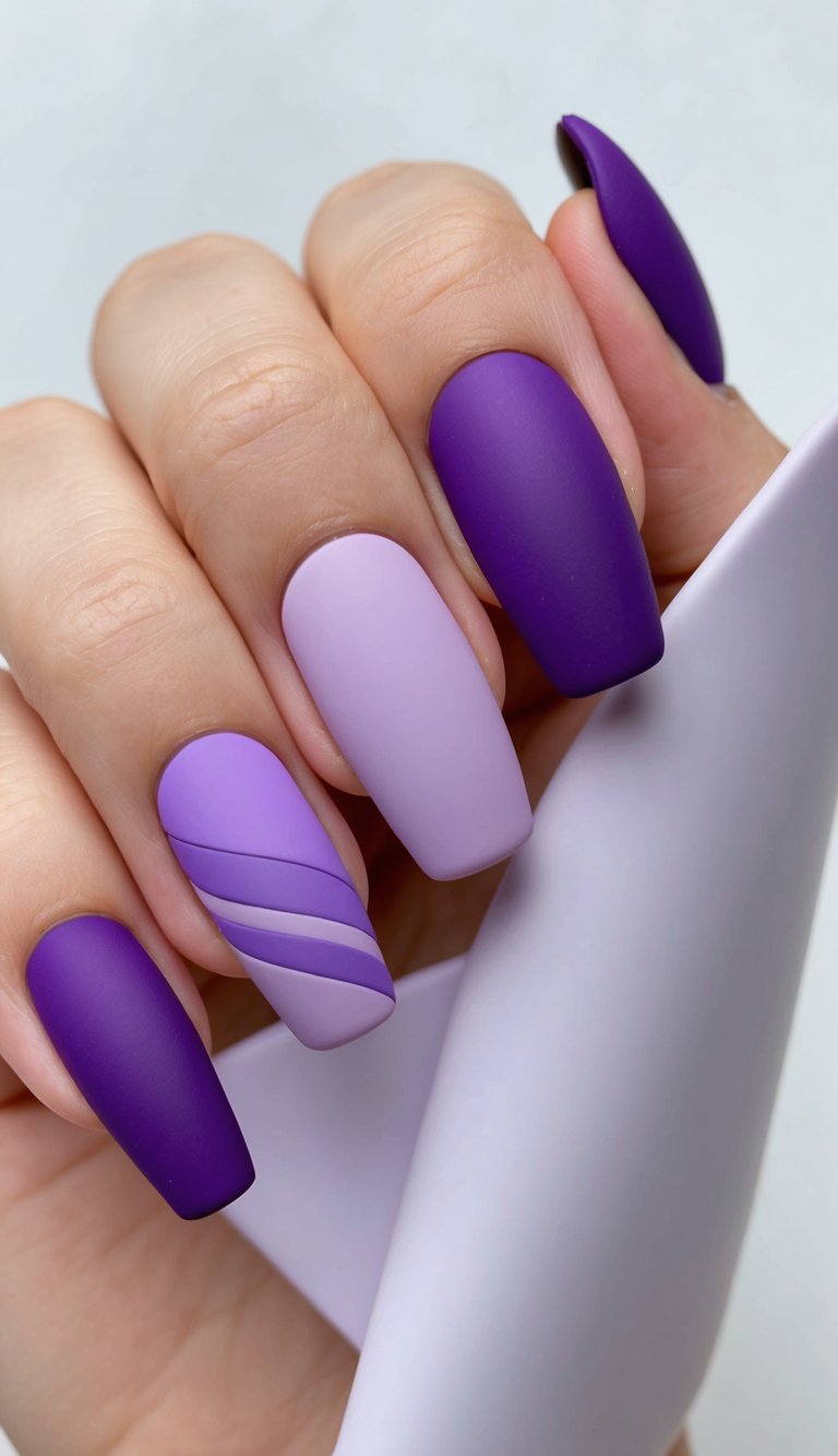 Elegant matte lavender and purple nail design with subtle diagonal striping for a softly structured look.