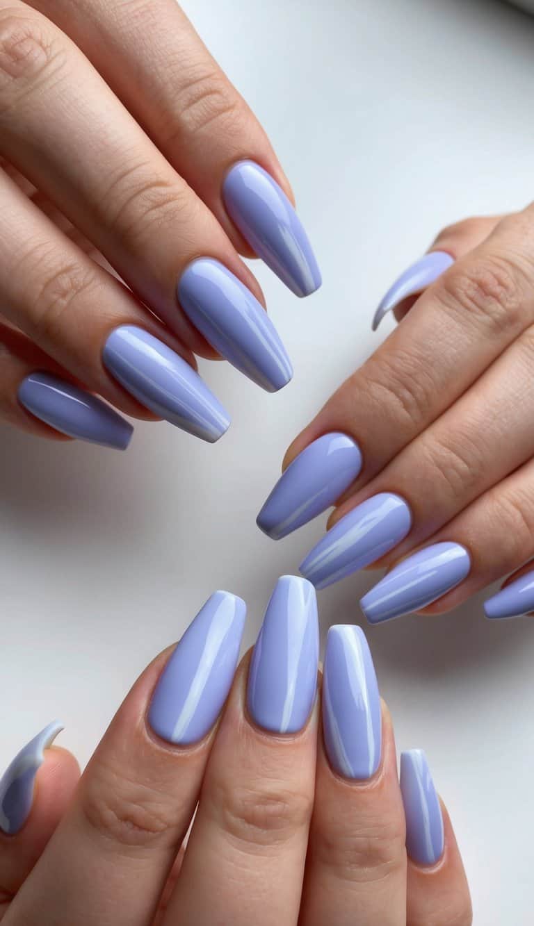 Soft periwinkle brush strokes on periwinkle nails like a painter's canvas