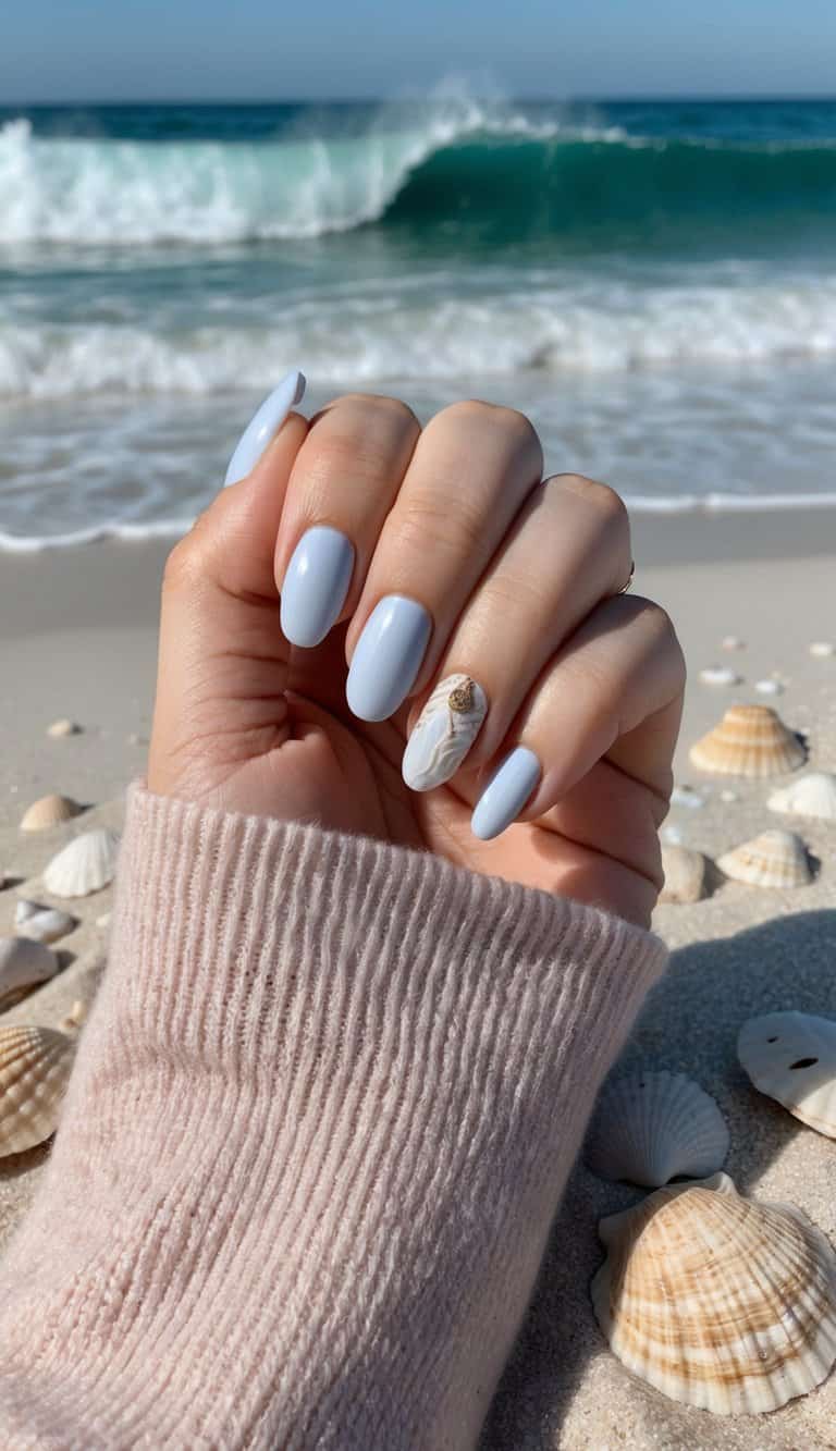 A dreamy periwinkle manicure with seashell textures on an accent nail