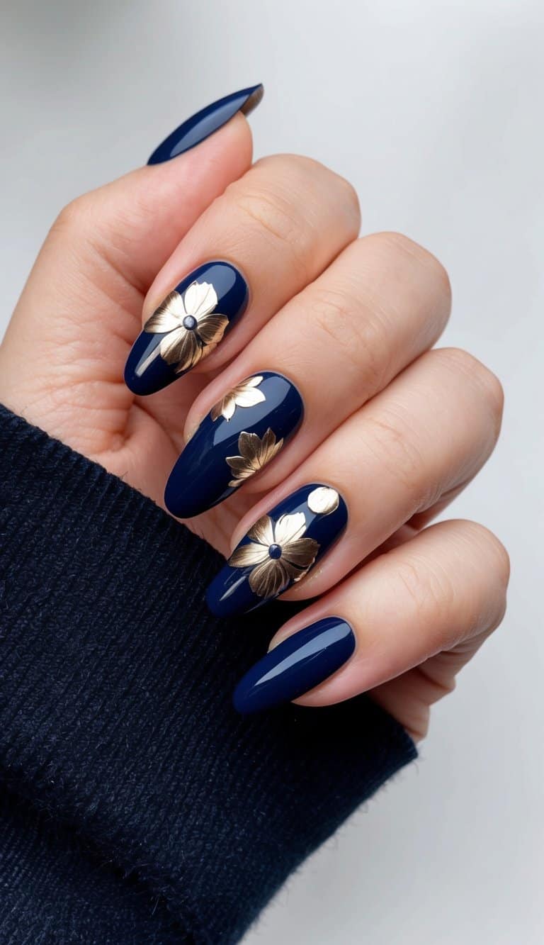 A collection of navy blue nail art designs with metallic floral water decals