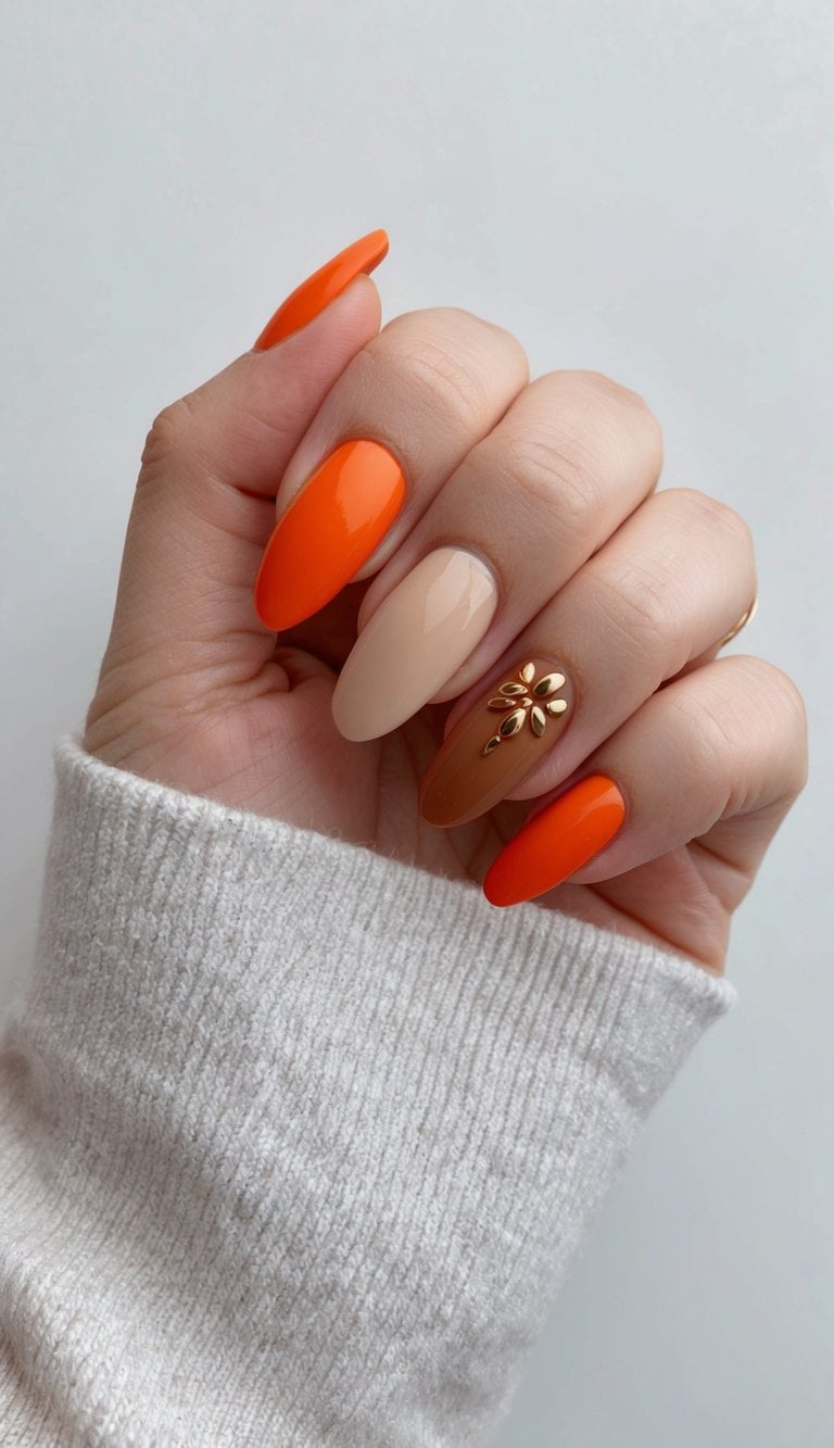 Vibrant orange almond nails with caramel cream contrast