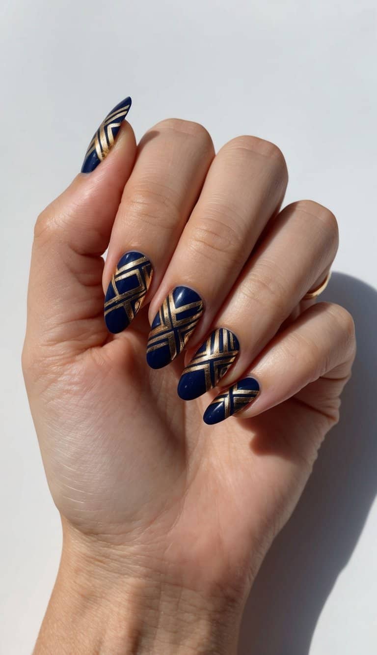 A navy and gold geometric pattern on nails with metallic finish