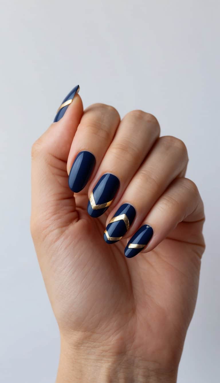 A navy blue nail art design with metallic yellow accents