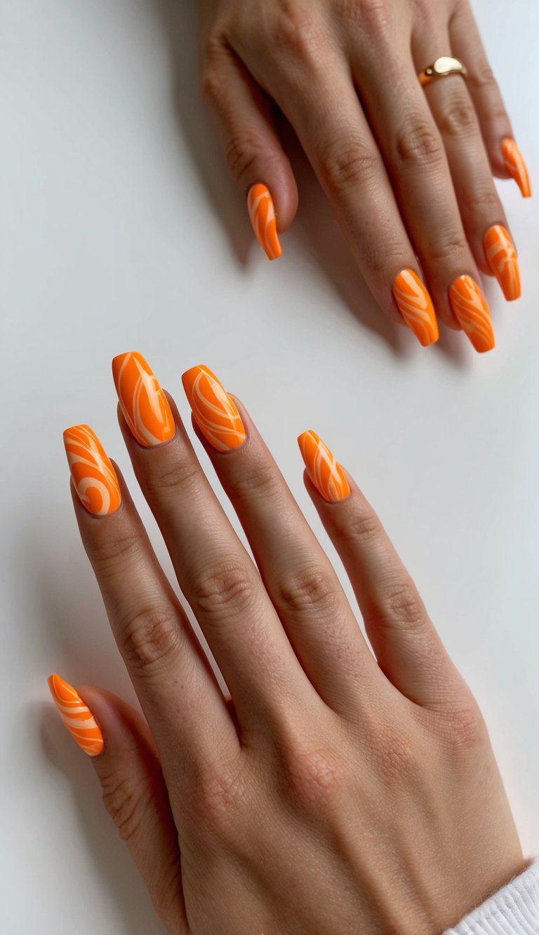 Bright tangerine nails featuring bold retro-style white swirls for a fun and nostalgic orange nail art look.