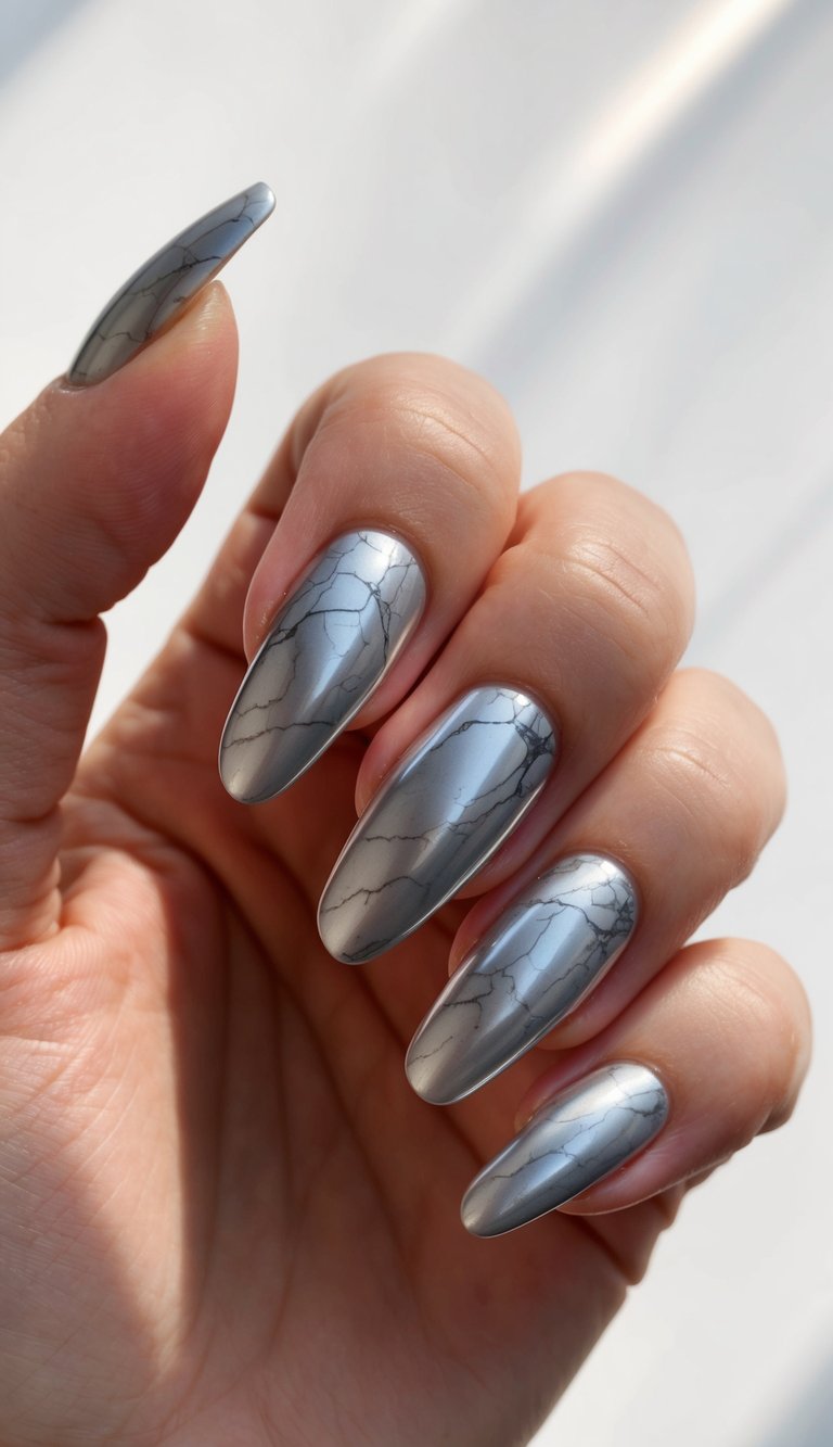 A close-up of sleek silver nails with a marble effect, reflecting light and creating a stunning visual texture