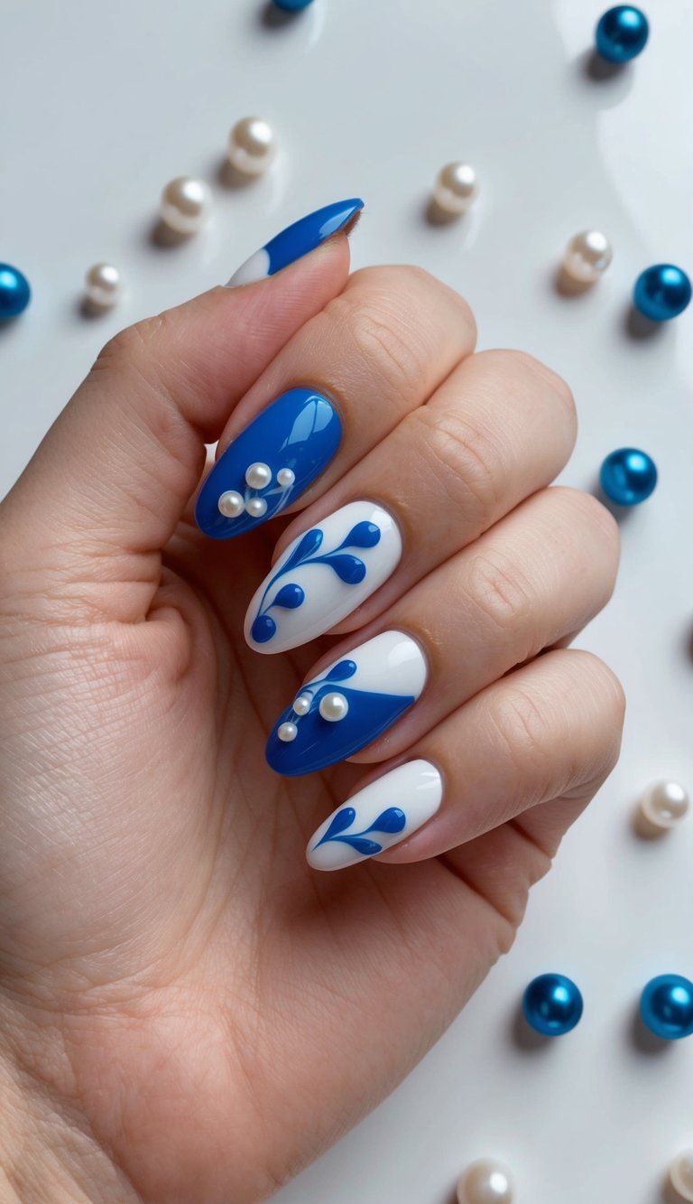 A close-up of blue and white nail art designs on a glossy surface with dewy pearls scattered around