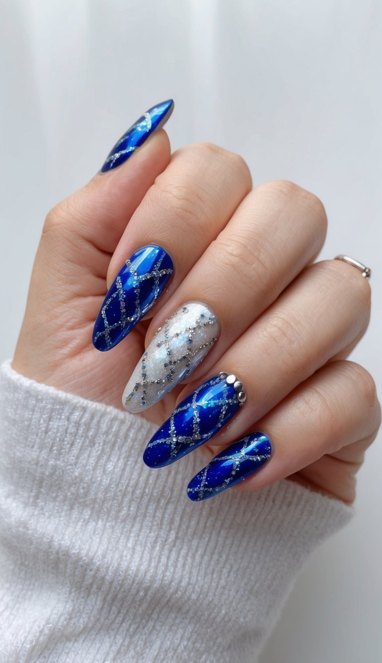 Deep blue nails featuring silver glitter lines and one shimmering silver accent, perfect for a chic celestial-inspired manicure.