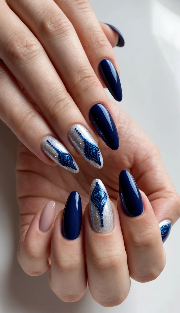 Navy blue nails paired with silver polish and paisley-style blue art, blending bohemian charm with luxe nail art finishes.