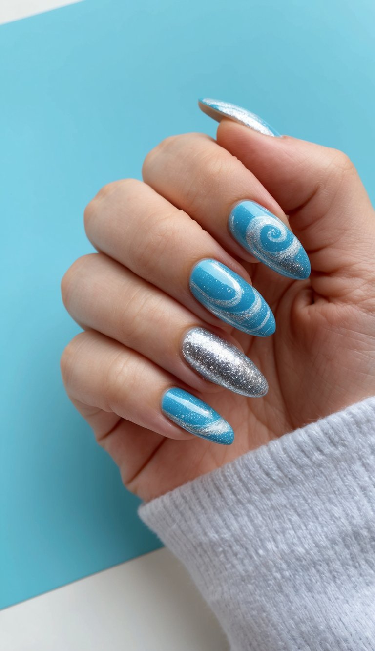 Aqua blue nails with glittery silver swirl patterns and full silver glitter accents, creating a playful, ocean-inspired nail look.
