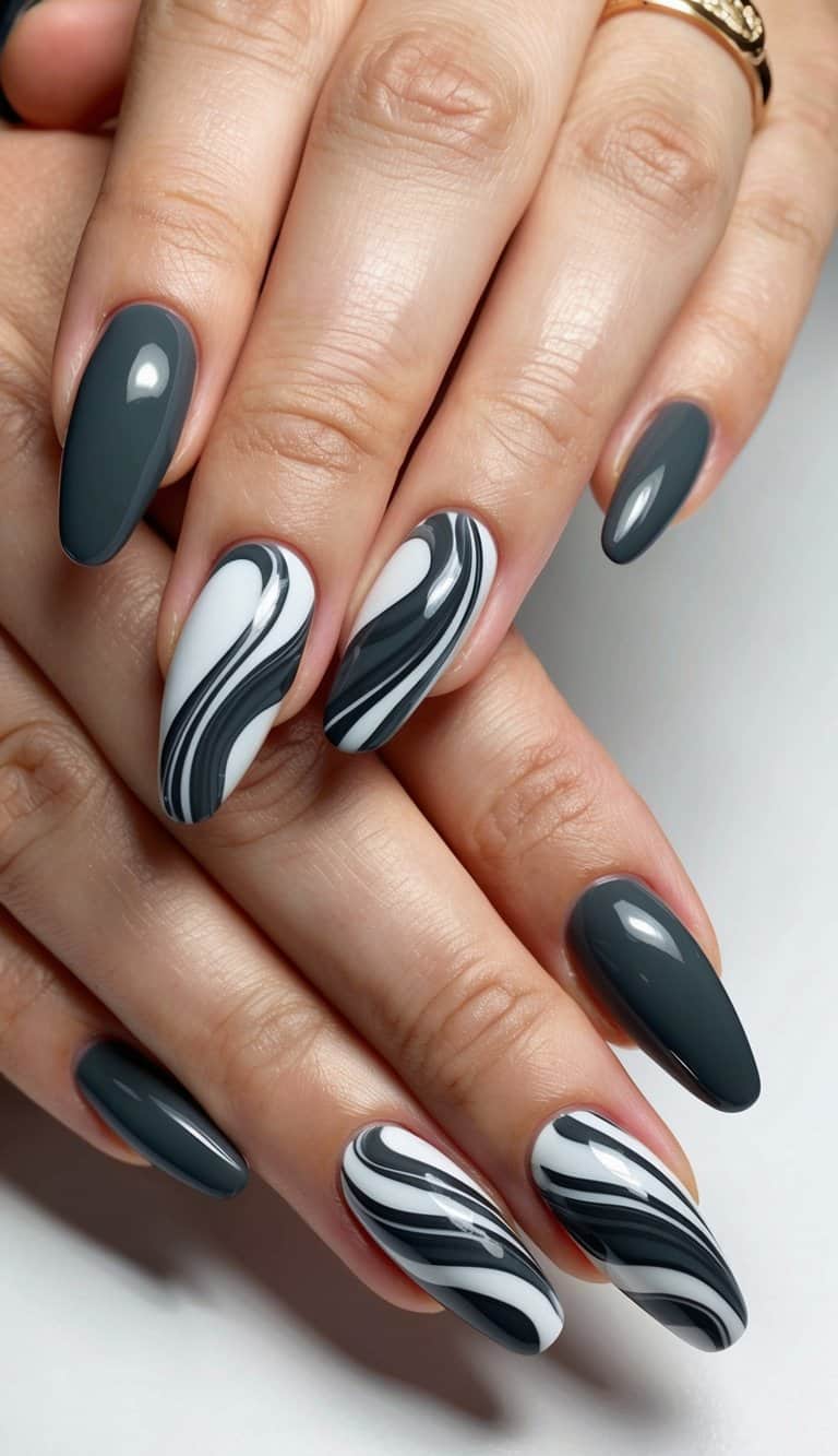 A close-up of chic charcoal swirls on glamorous nails