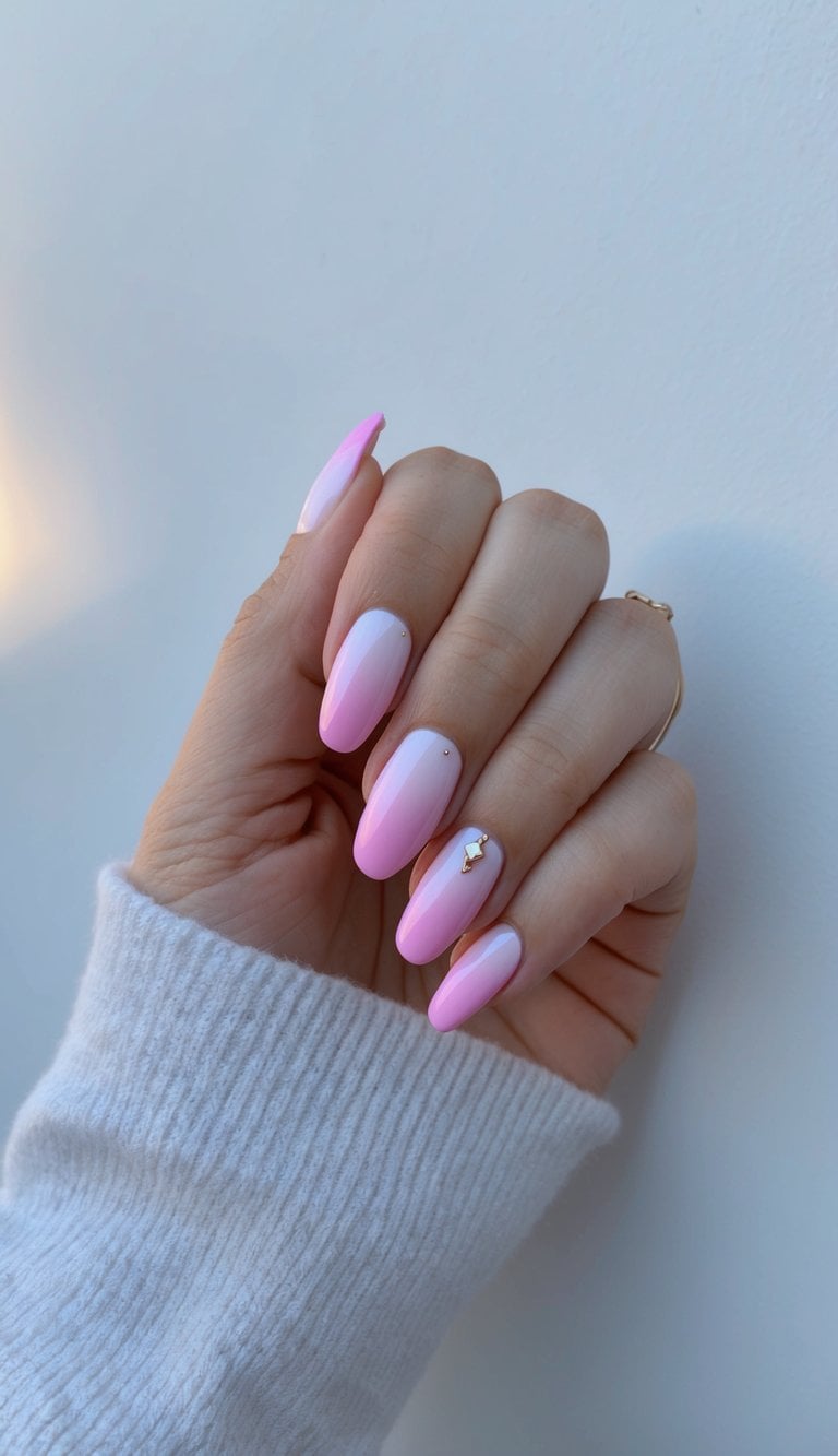Soft pink ombre nails on a clean, white background with a subtle twilight glow
