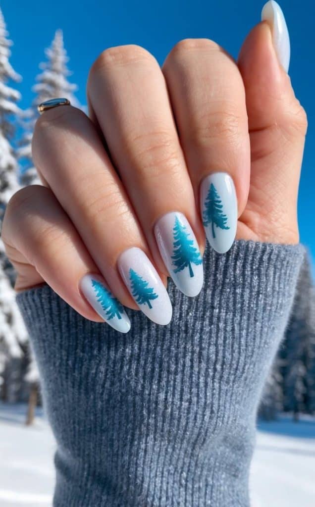 Nail designs inspired by a snowy forest with pine tree silhouettes