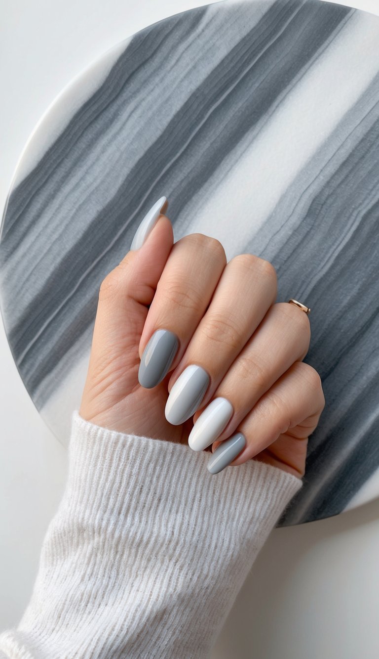 A marble surface with a gradient of muted gray tones, creating an elegant and smooth ombre effect