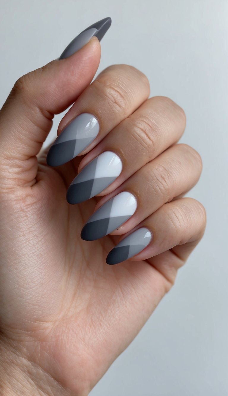 A shadowy chevron design in elegant gray ombre nail art