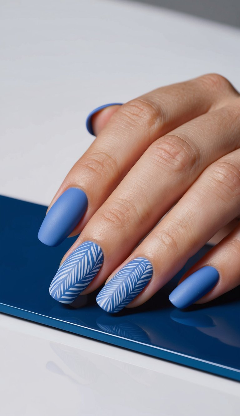 A close-up of cornflower blue matte nail art designs on a sleek surface, with a subtle shine highlighting the intricate patterns and shades of blue