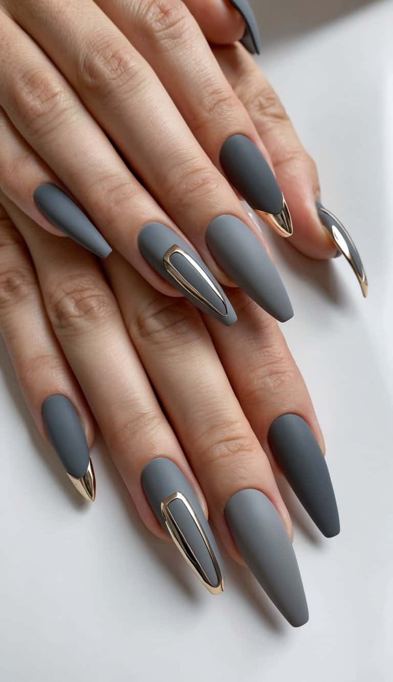 Sleek matte gray nails with metallic accents in various designs