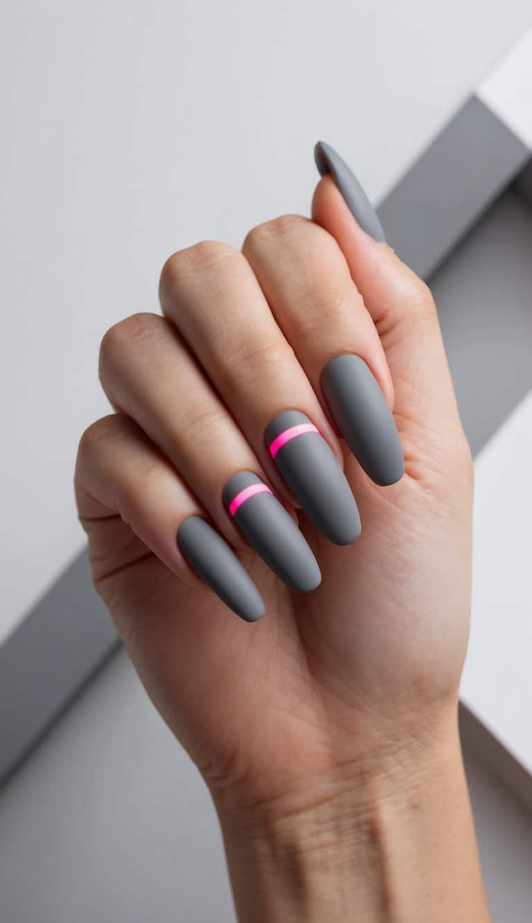 A close-up of matte gray nails with neon accents, set against a sleek and modern backdrop