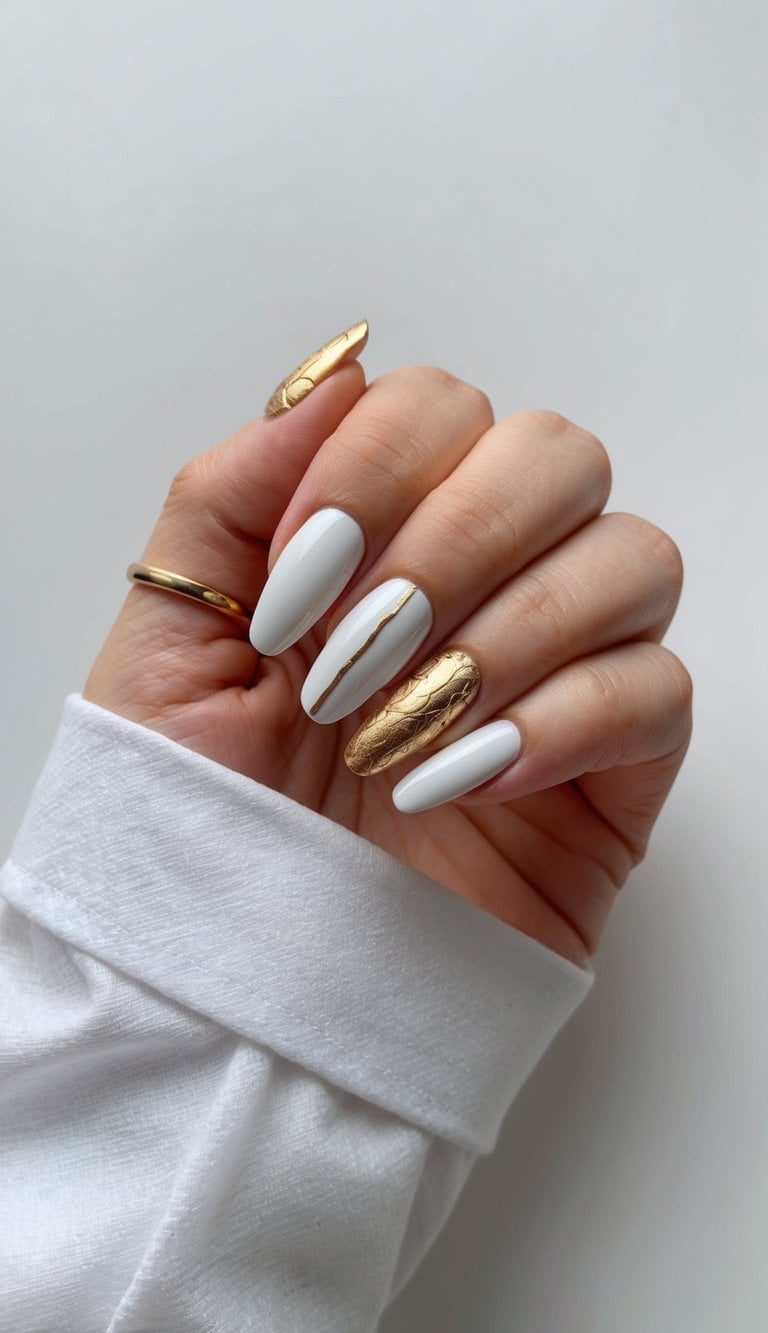 Elegant white and gold nail art designs displayed on a clean, minimalist background