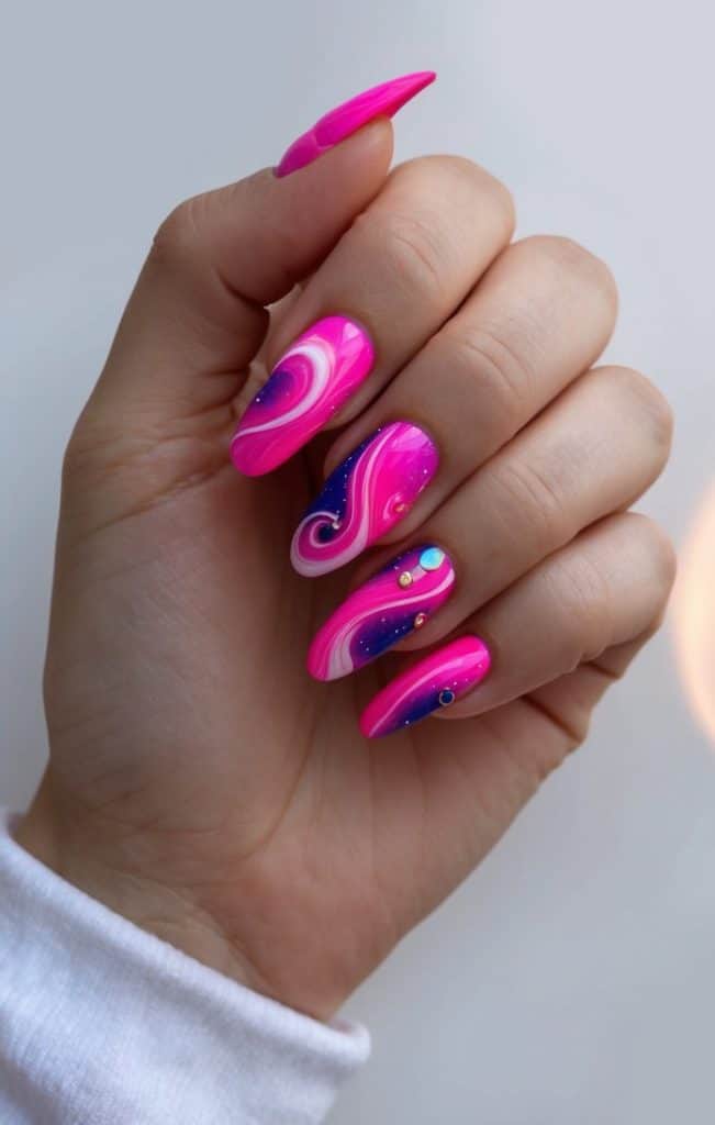 Vibrant hot pink nail art designs swirling with cosmic dreamscapes