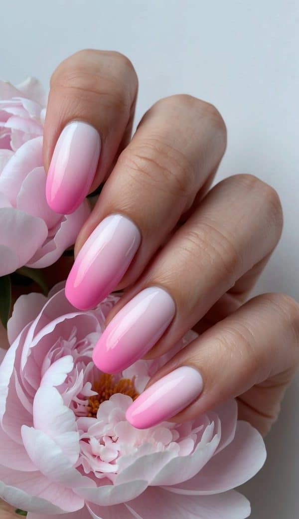 Soft pink nails fading into a dreamy ombre gradient, creating a delicate and feminine nail art design