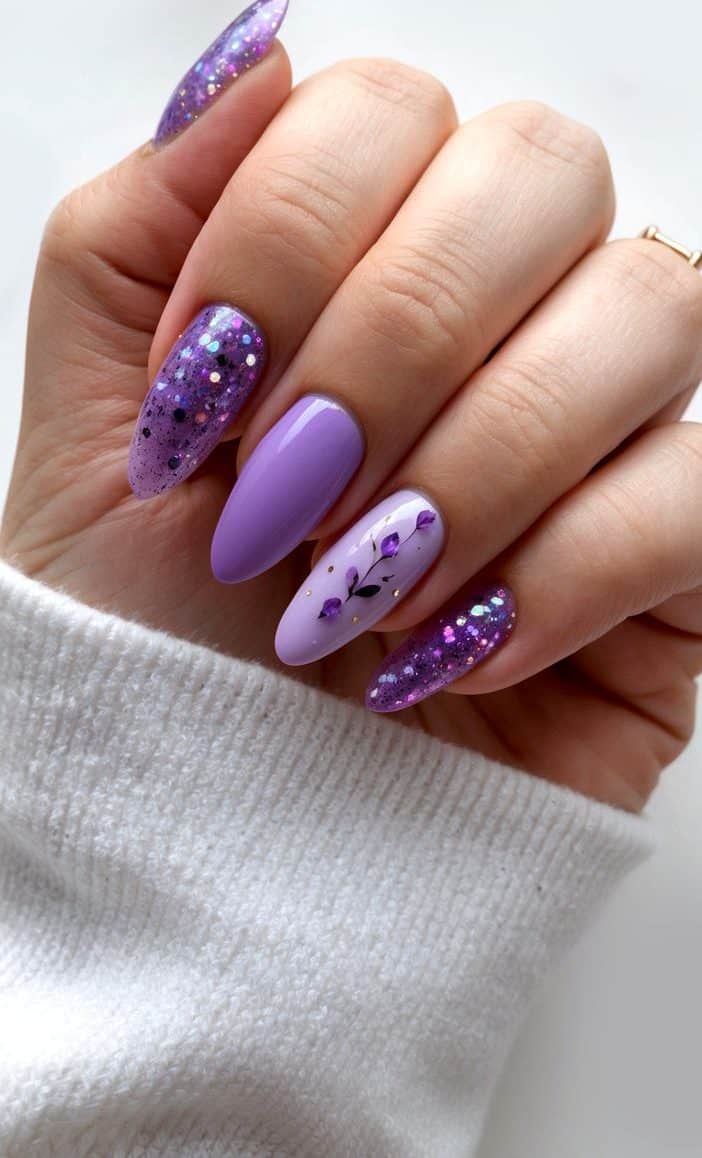 A close-up of lavender glitter and blooms on nails