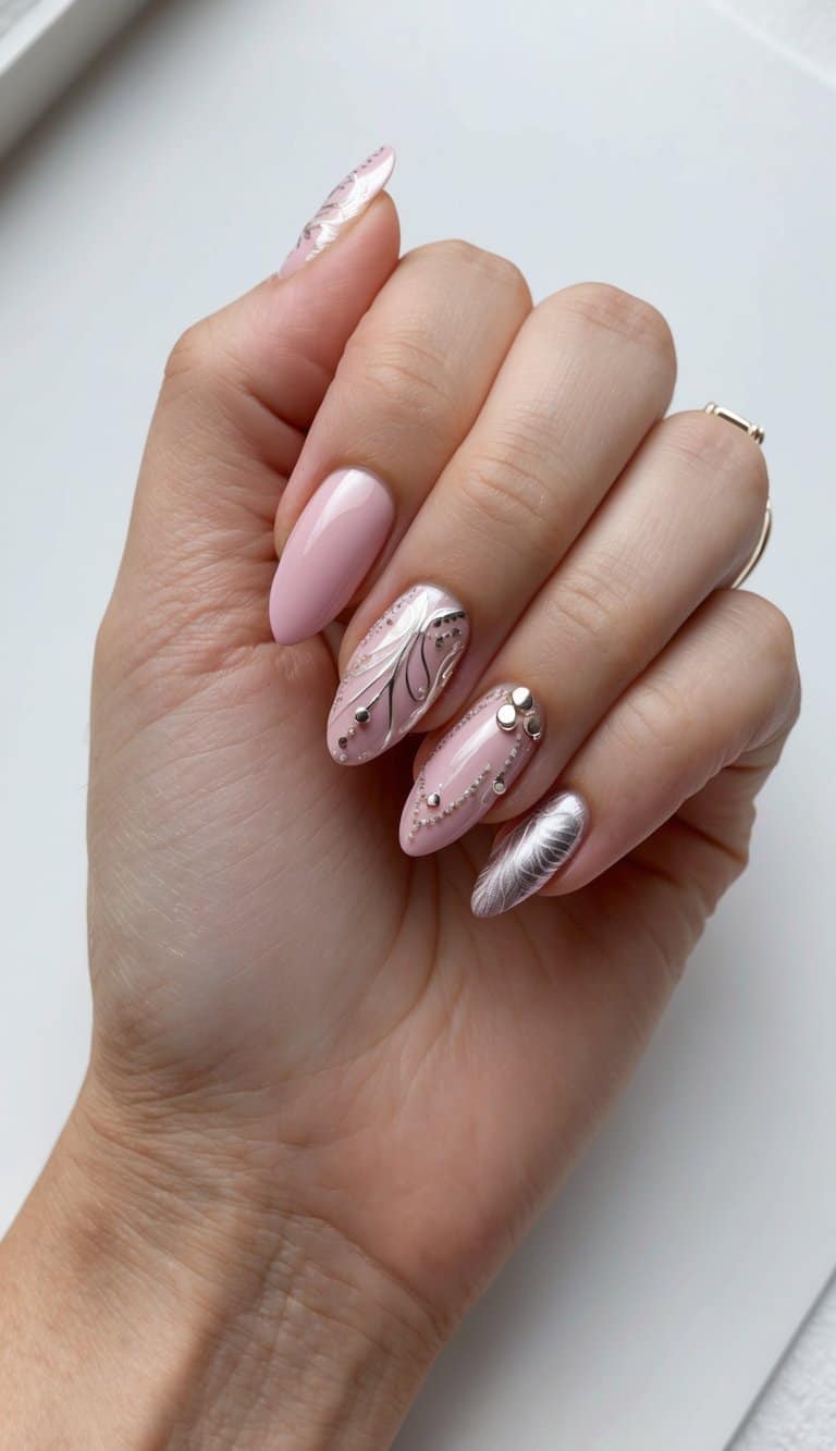 A pink and silver nail art design featuring delicate patterns and intricate details