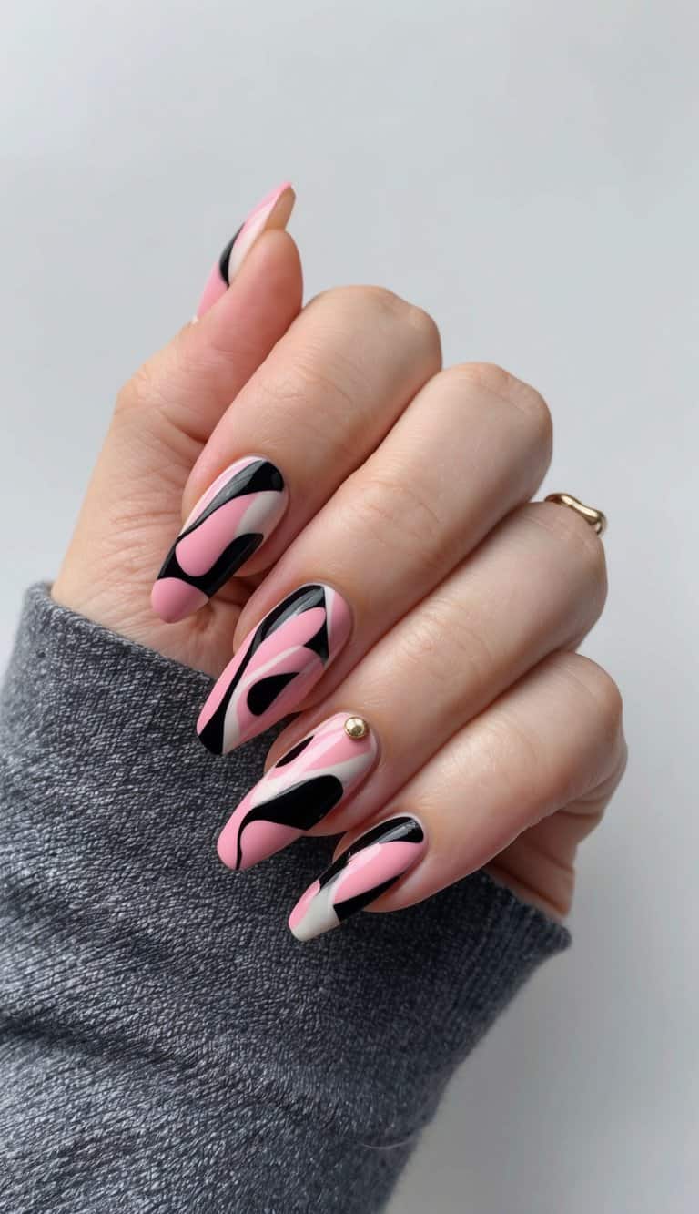 A swirling mix of pink and black abstract shapes on a nail canvas