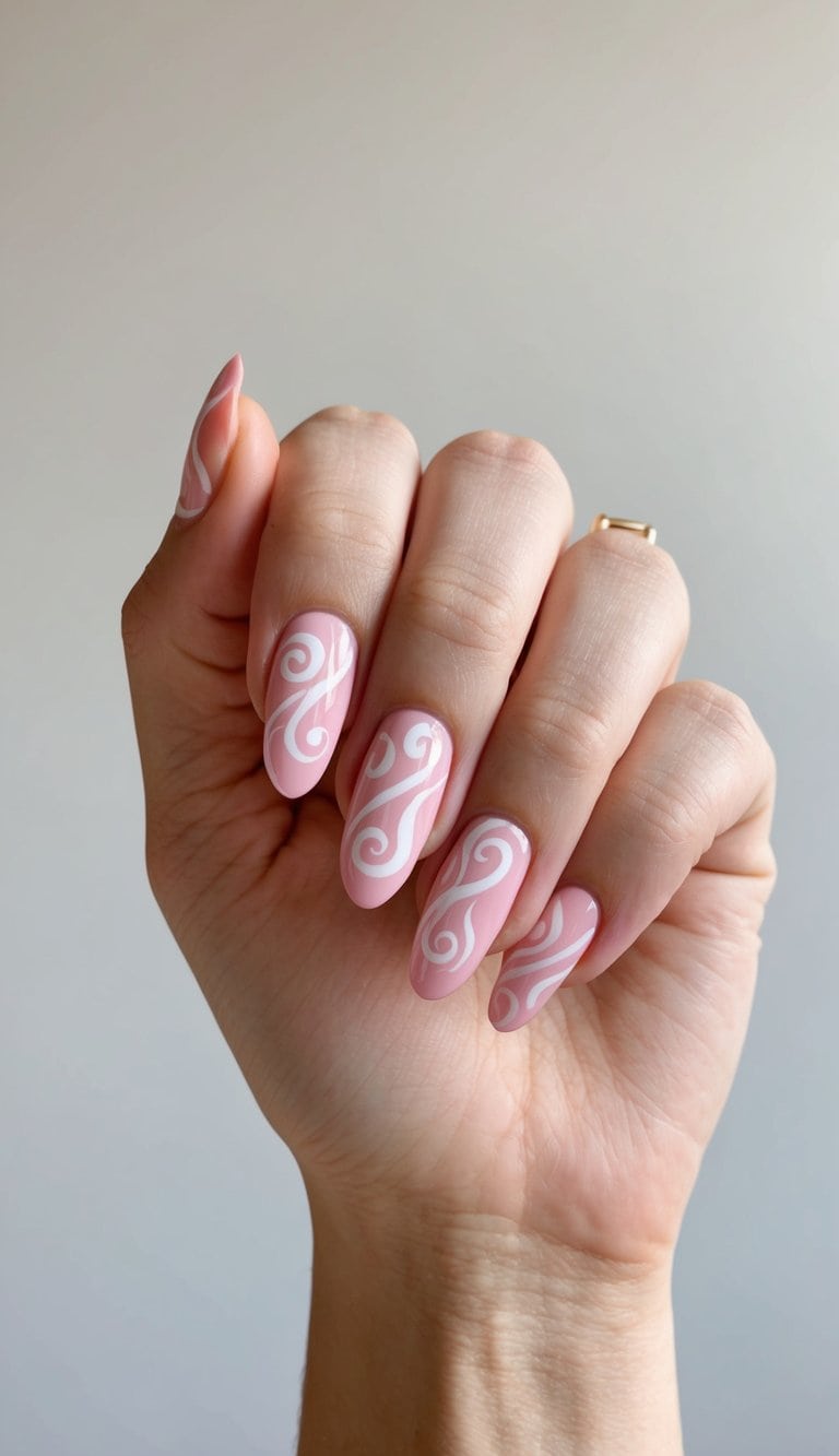 Pink nails with white swirl designs on a clean, neutral background