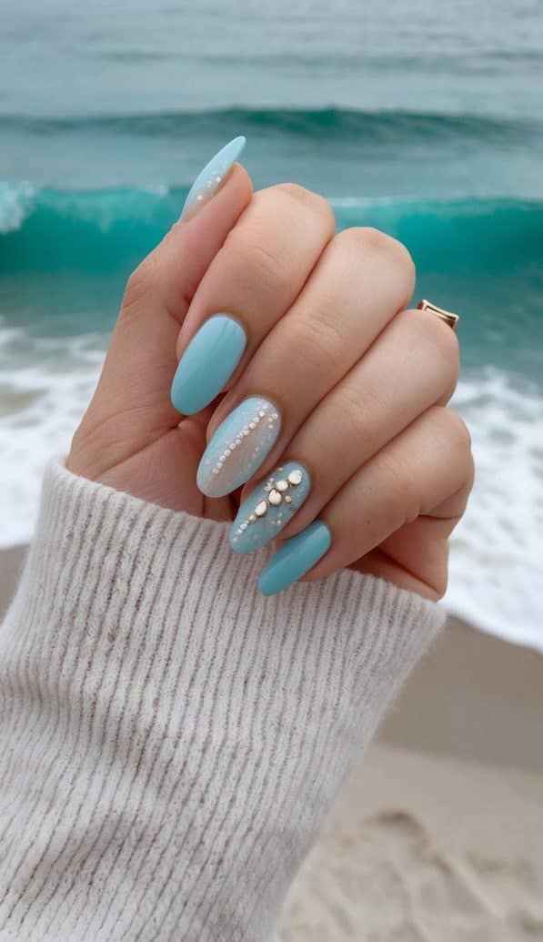 A tranquil azure ocean with gentle waves crashing against the shore, surrounded by a serene and peaceful atmosphere