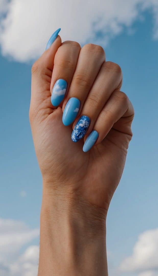 A serene sky with cornflower blue clouds, showcasing 50 gorgeous blue nail art designs