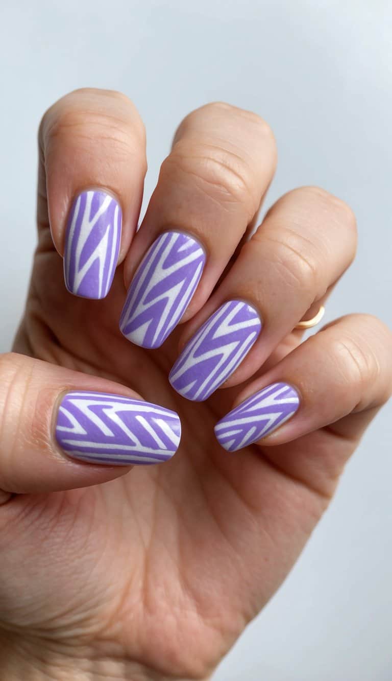 Dreamy lavender tribal print nail art designs arranged in a pattern, featuring a paste-like texture
