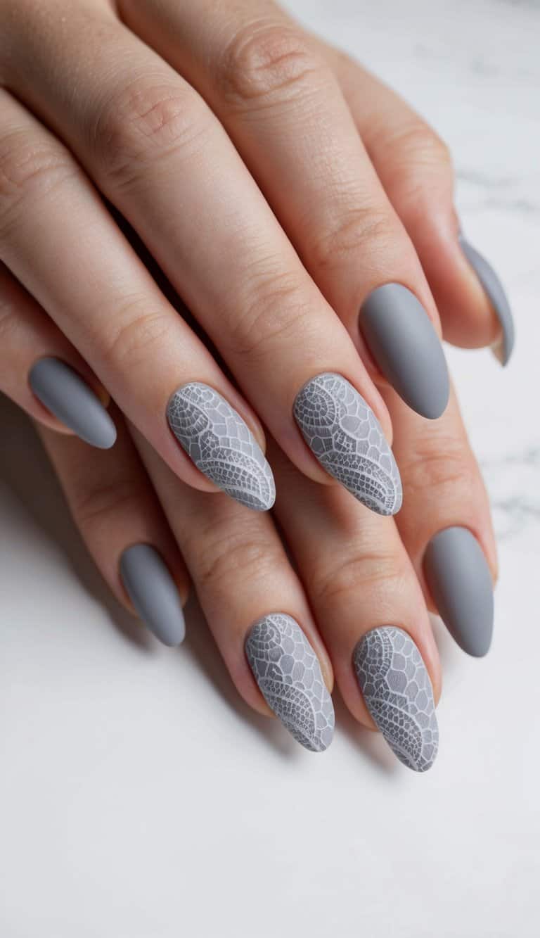 A close-up of elegant gray lace patterns on matte nails