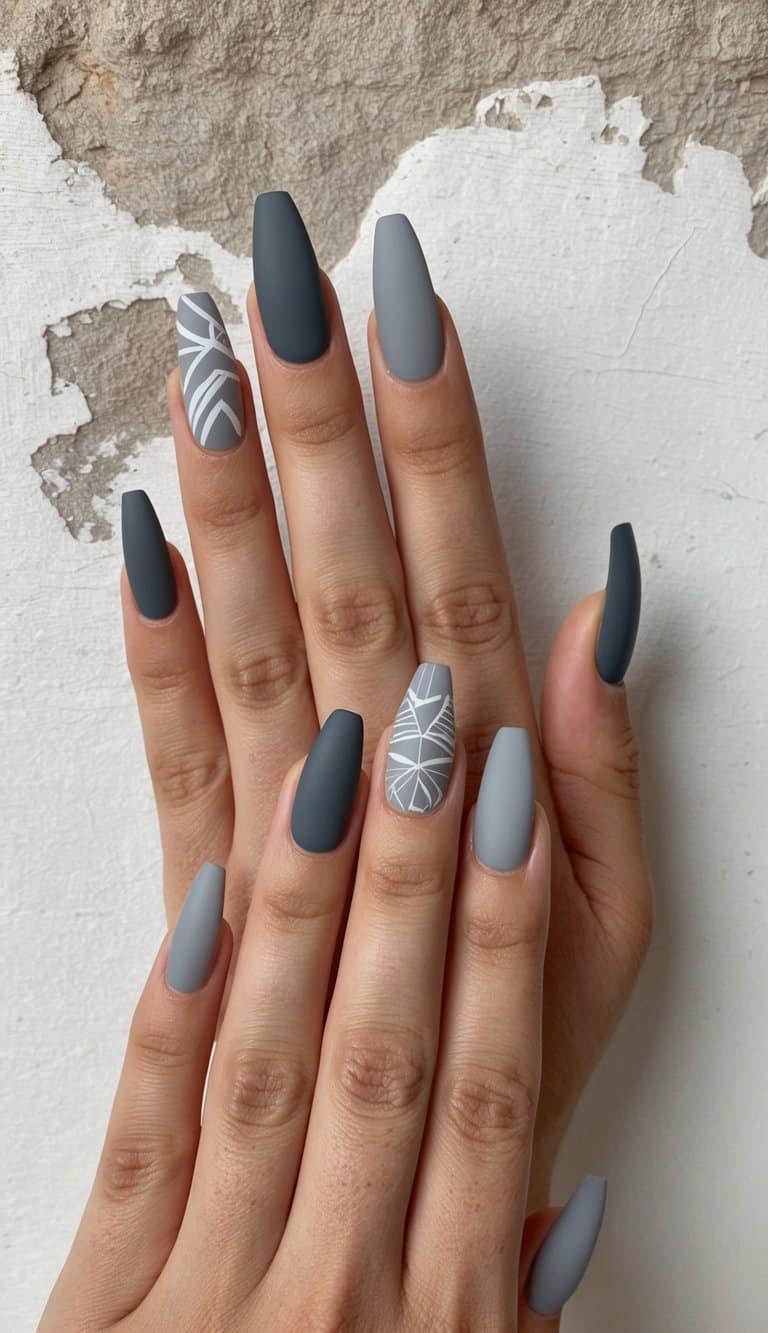 A rustic stonewashed background with 50 elegant gray nail art designs in matte finish