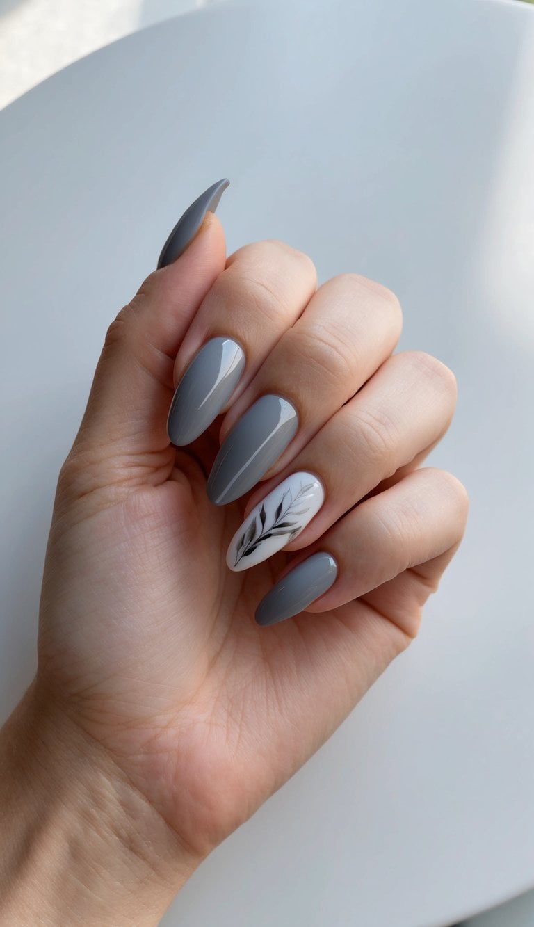 A sleek gray nail art design displayed on a polished surface, with elegant and sophisticated details