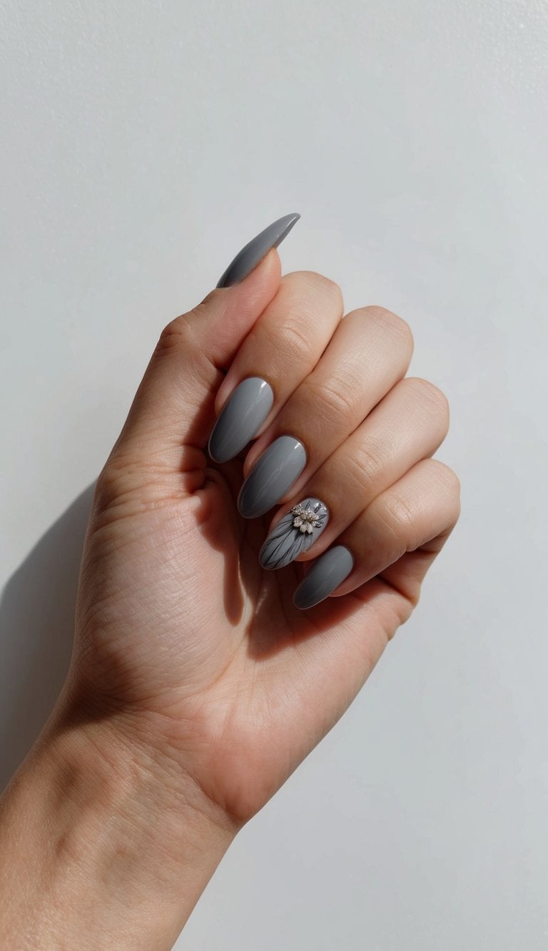 A sleek, modern hand with sophisticated gray nails against a matte background, showcasing elegant and chic nail art designs