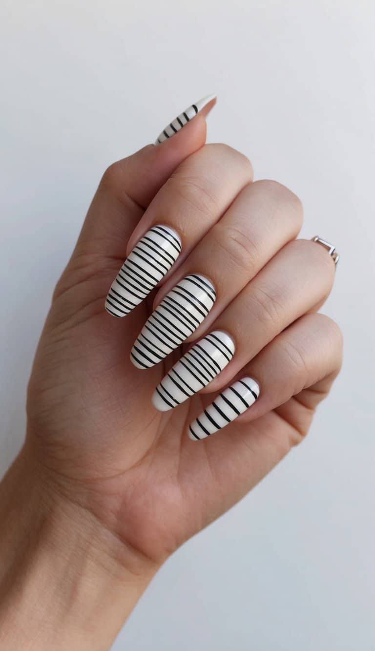 A close-up view of crisscrossing band stripes in various thin line art nail designs