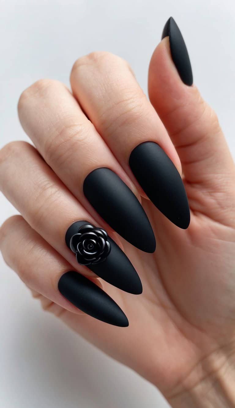 A sleek, matte black nail adorned with a single black rose accent