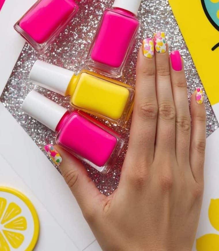 Bright pink and yellow nails with lemon yellow and soft pink elements