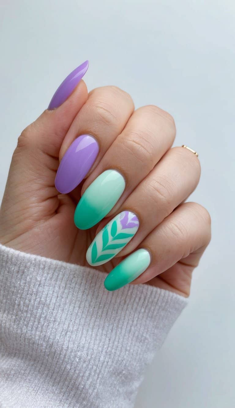 A close-up of mint and lilac ombre nails with vibrant mint green nail art designs