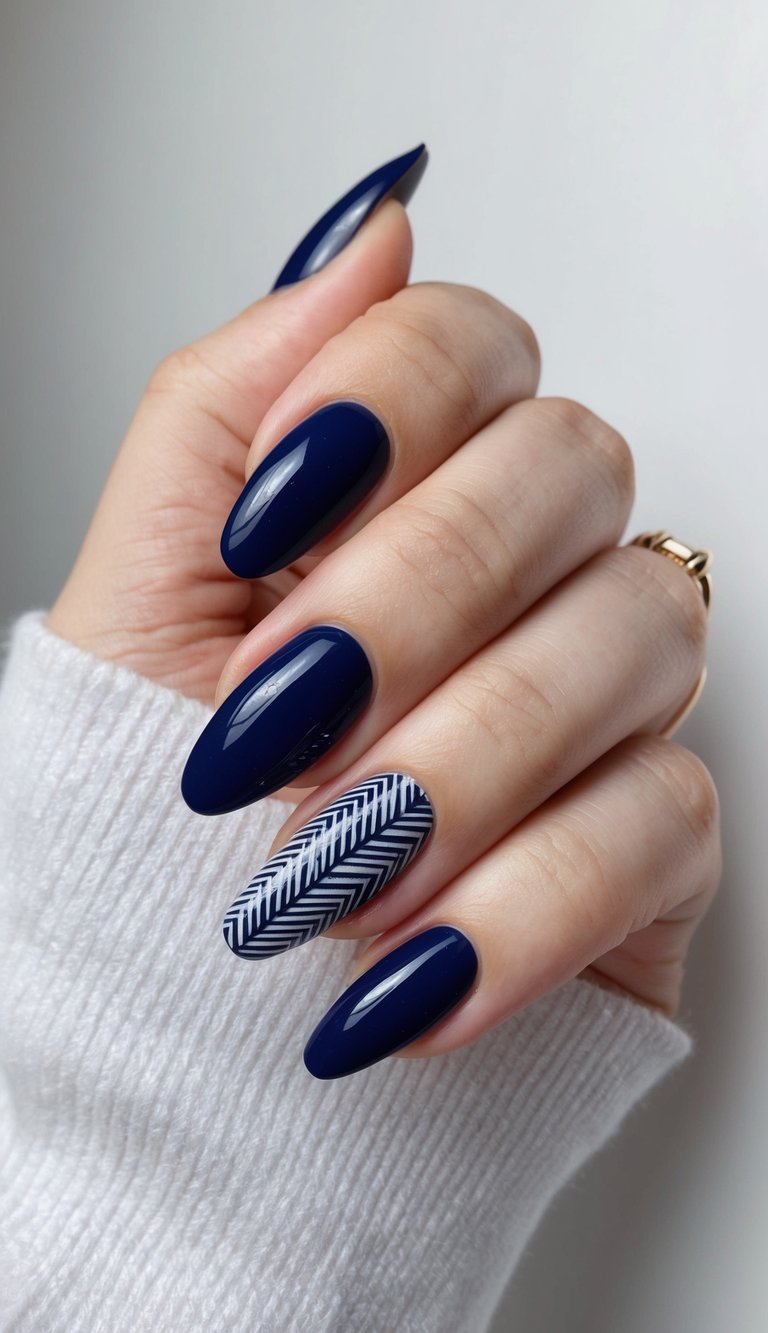 A close-up of navy blue nails with intricate cross-hatch patterns