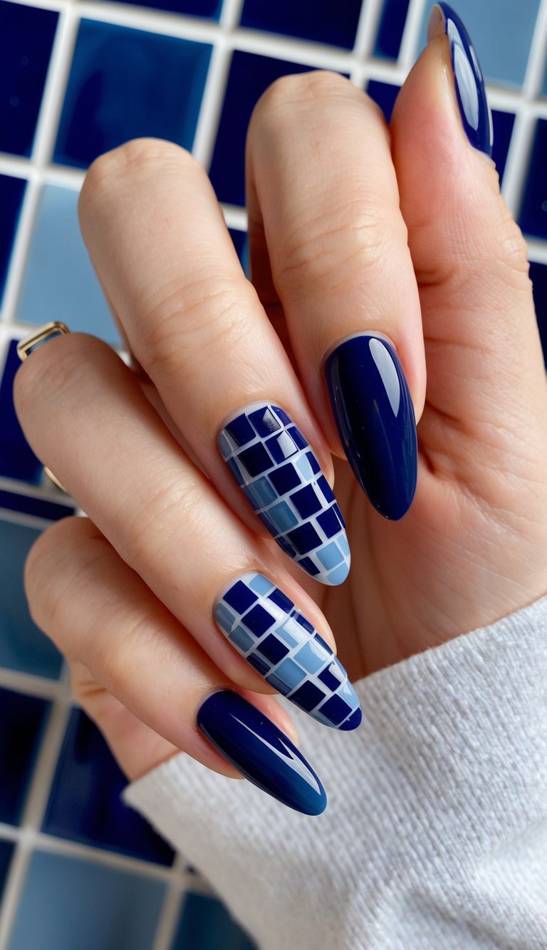 A close-up view of navy blue mosaic tiles in varying shades, creating a rich and luxurious impression