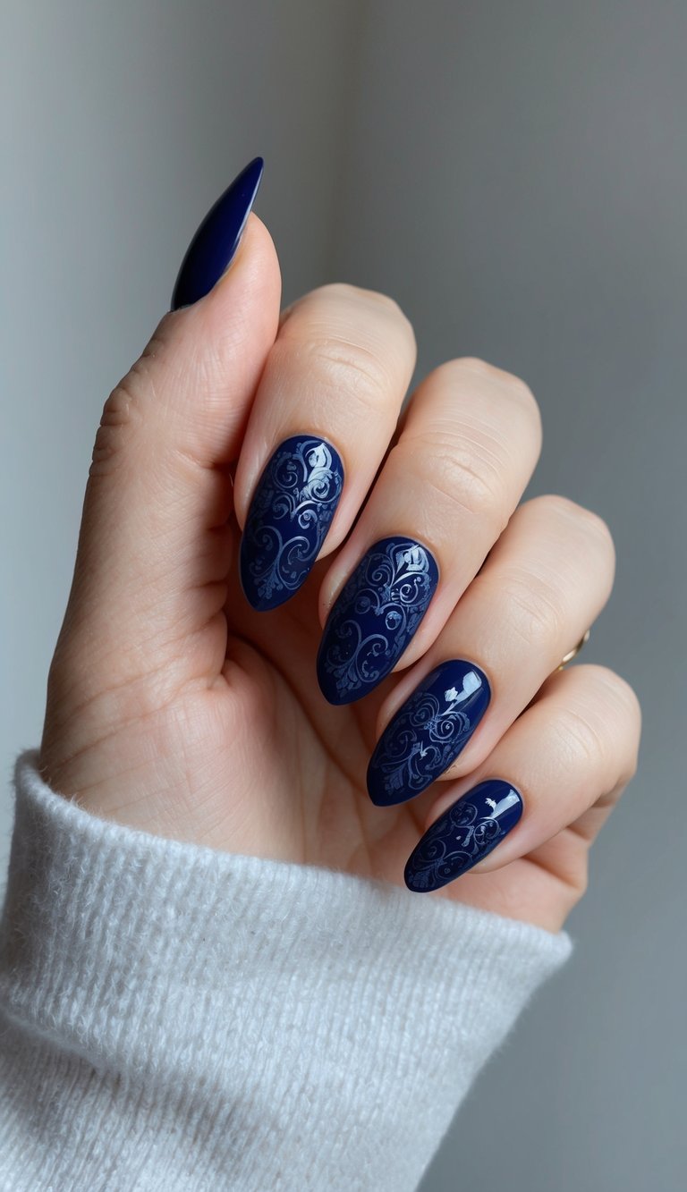 A regal navy blue nail art design with intricate baroque patterns and dark midnight tones