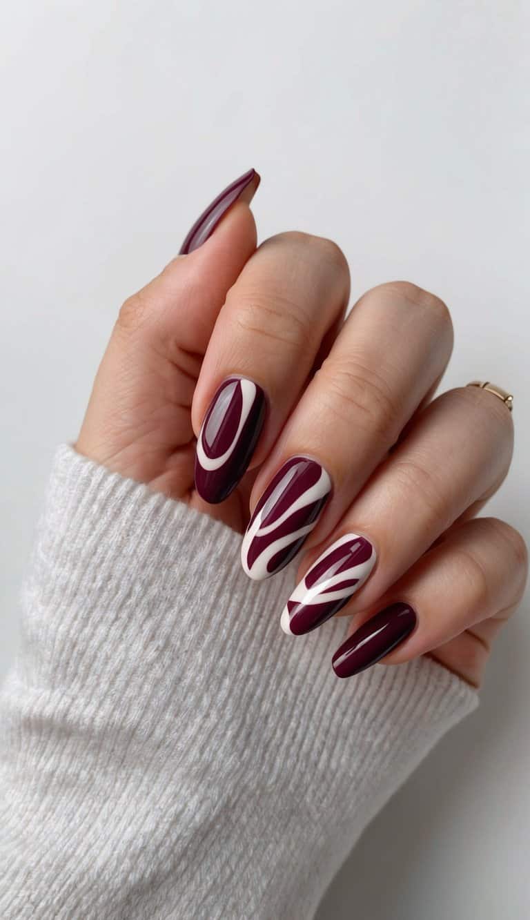 Maroon abstract shapes swirling on nails