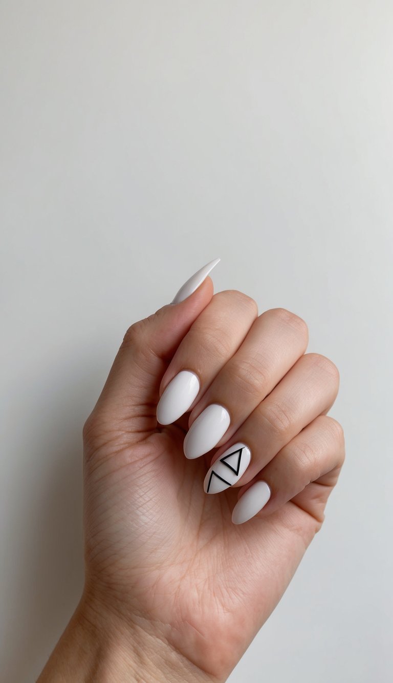 A single, simple triangle accent nail design on a chic, minimalist background