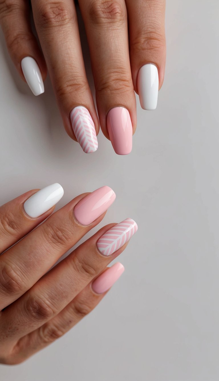 A close-up of pink and white nail art designs on a clean, neutral background