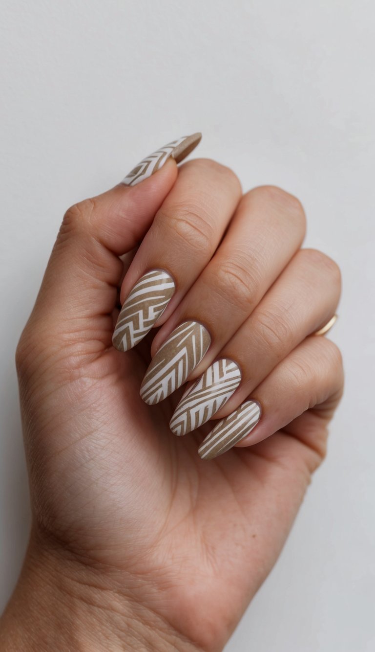 Subdued tribal patterns on nails, minimalist design with earthy tones