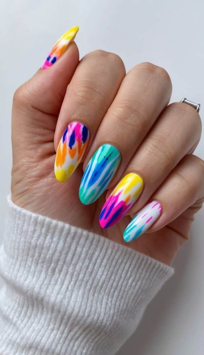 A colorful array of tie-dye nail patterns, perfect for spring break vacation vibes